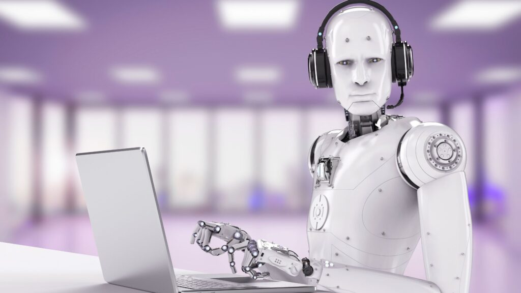 Robot wearing a headset and working on a laptop