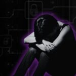 person holding head in lap in front of cyber background
