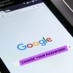 Tablet showing the google page and a change your password message