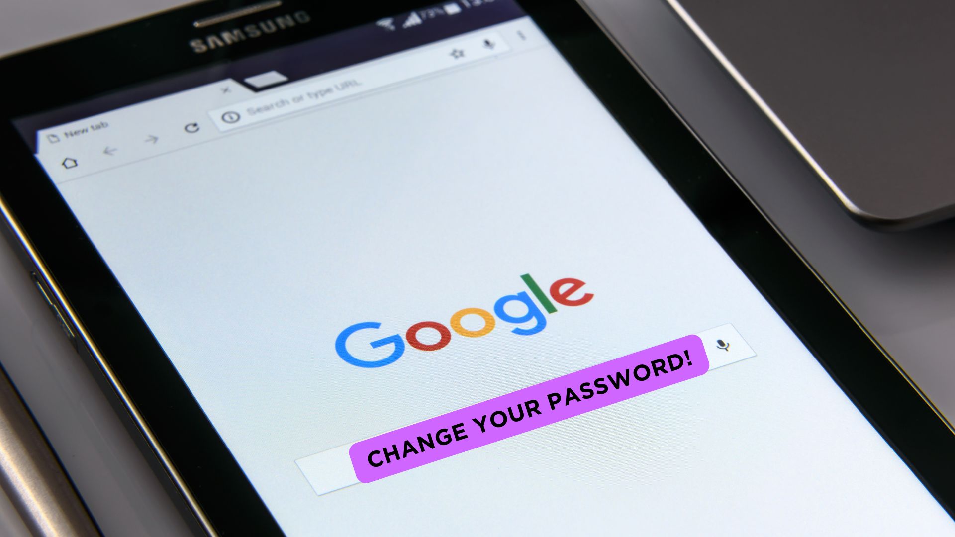 Tablet showing the google page and a change your password message