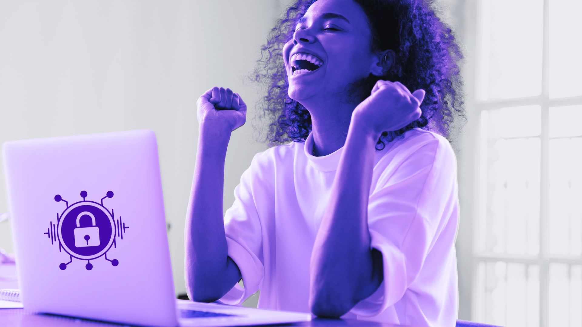 person in front of laptop excited about the cybersecurity wins for the weekend