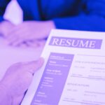 recruiter holding a fake resume