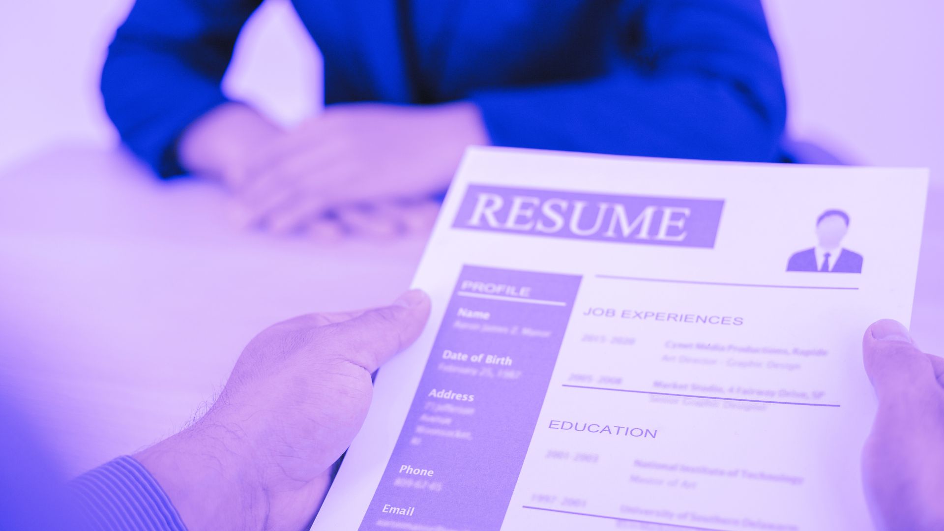recruiter holding a fake resume