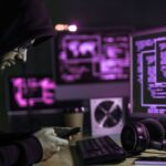 SOC analyst at their desk monitoring threats
