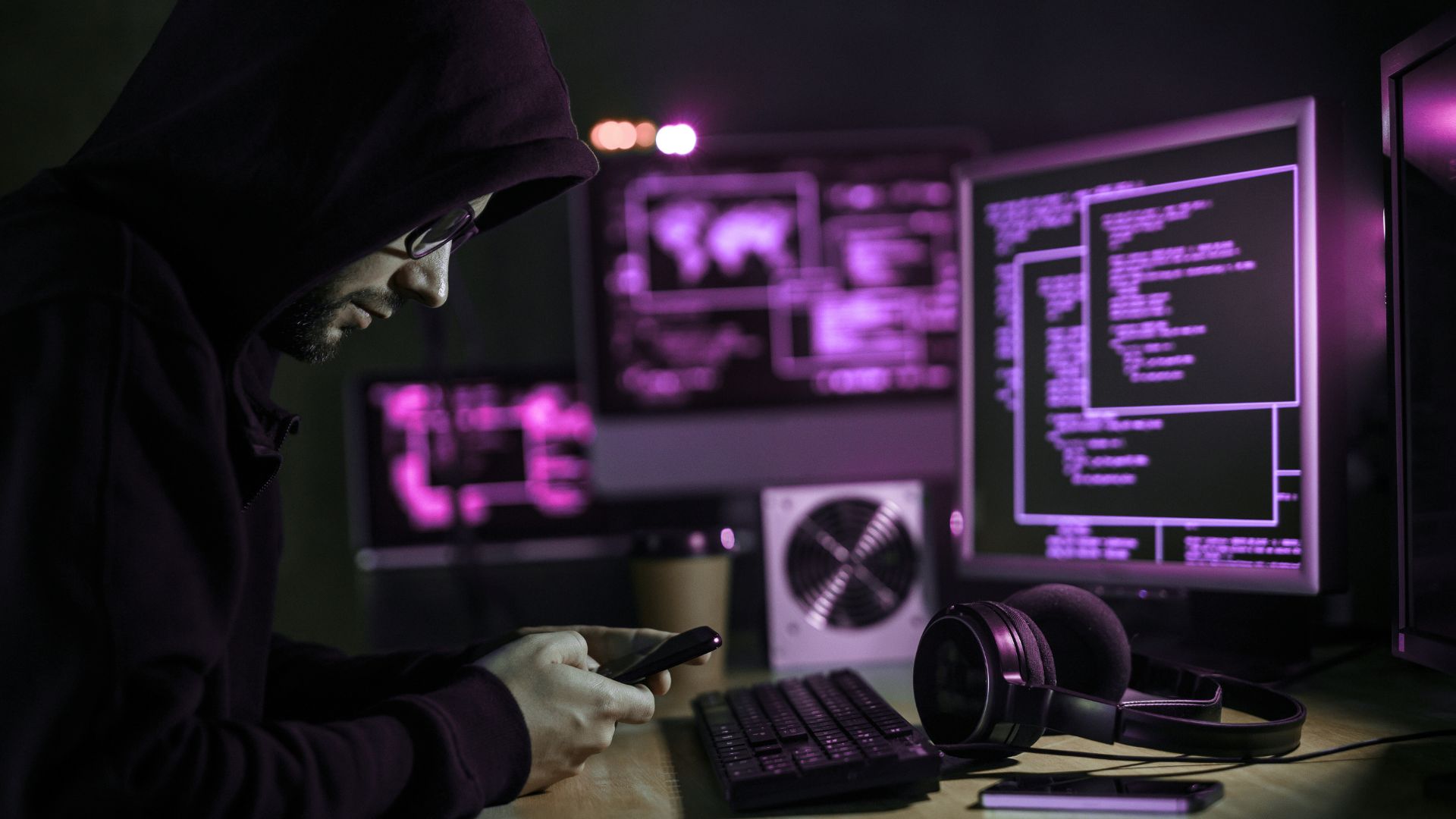 SOC analyst at their desk monitoring threats