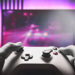 Person playing a game on a console
